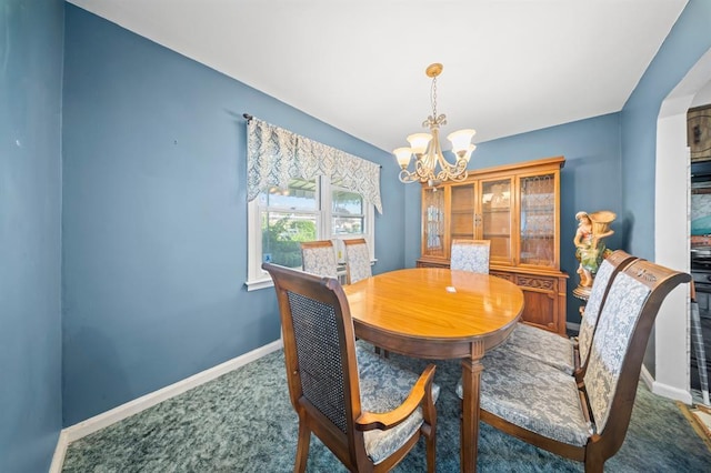 94 Shaw Ave, Valley Stream, NY 11580 - carpeted dining area with a chandelier and baseboards