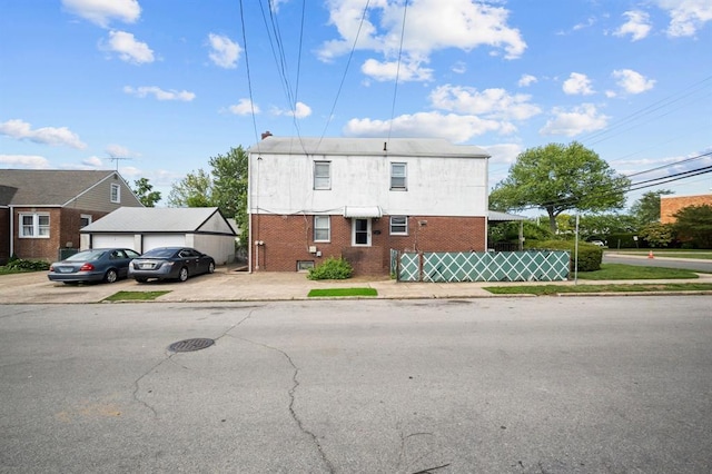 94 Shaw Ave, Valley Stream, NY 11580 - view of front of house with brick siding and a garage