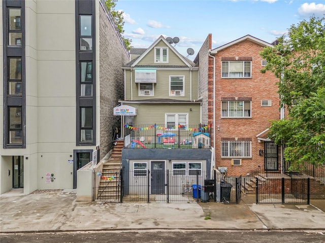 62 Buchanan Pl, Bronx, NY 10453 - view of building exterior with a fenced front yard and stairway