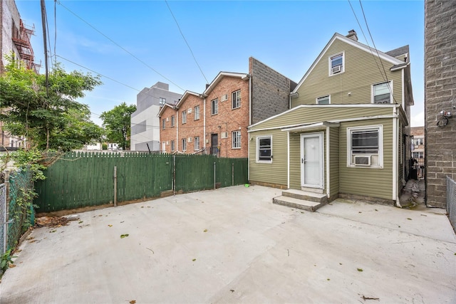 62 Buchanan Pl, Bronx, NY 10453 - back of property featuring entry steps, a patio area, and cooling unit