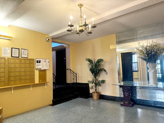 83-83 118th St Unit 6L, Kew Gardens, NY 11415 - building lobby featuring a textured ceiling, stairway, and a surveillance system