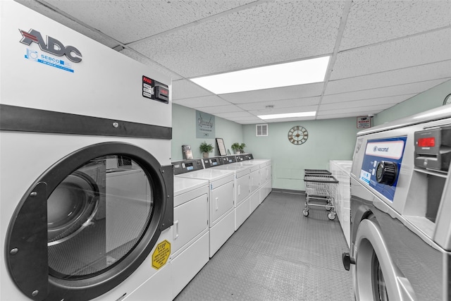1879 Crompond Rd Unit E16, Peekskill, NY 10566 - shared laundry room featuring washer and clothes dryer and baseboards