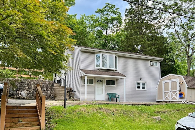 33 Roosevelt Pl, Stony Point, NY 10980 - rear view of house with a storage shed, stairway, a yard, view of scattered trees, and a shingled roof