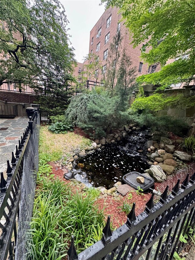 37-27 86th St Unit 3D, Flushing, NY 11372 - view of yard with a small pond