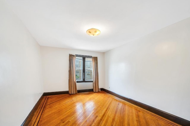 11467 202nd St, Saint Albans, NY 11412 - empty room featuring light wood-style flooring and baseboards