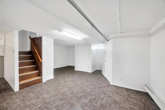 11467 202nd St, Saint Albans, NY 11412 - finished basement with a baseboard heating unit and stairway