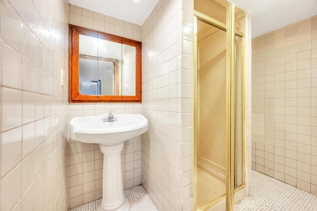 11467 202nd St, Saint Albans, NY 11412 - bathroom featuring tile walls, a shower stall, and tile patterned floors