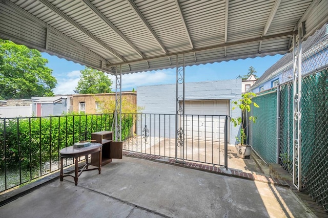 11467 202nd St, Saint Albans, NY 11412 - view of patio featuring a garage