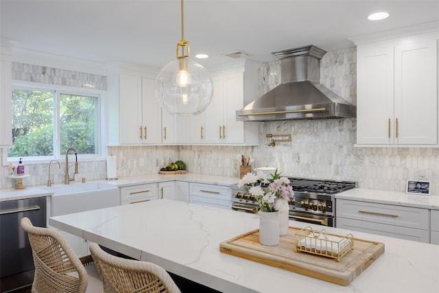 7 Long View Dr, Wading River, NY 11792 - kitchen featuring wall chimney range hood, appliances with stainless steel finishes, white cabinetry, light stone countertops, and recessed lighting