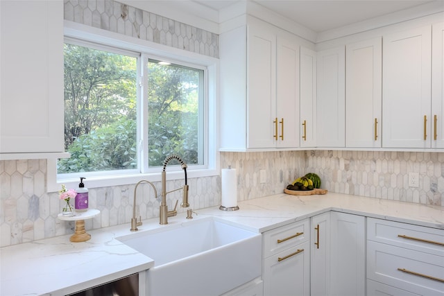 7 Long View Dr, Wading River, NY 11792 - kitchen with white cabinetry, healthy amount of natural light, backsplash, and light stone countertops