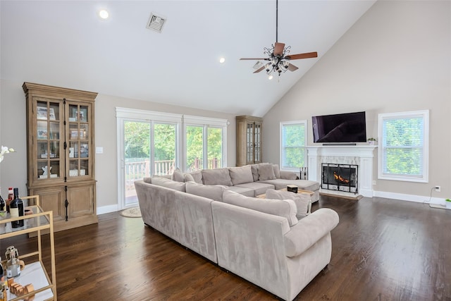 7 Long View Dr, Wading River, NY 11792 - living area featuring a ceiling fan, high vaulted ceiling, a warm lit fireplace, dark wood-type flooring, and recessed lighting