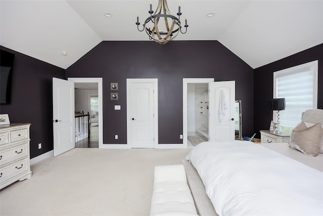 7 Long View Dr, Wading River, NY 11792 - bedroom featuring a chandelier, multiple windows, light colored carpet, ensuite bathroom, and high vaulted ceiling