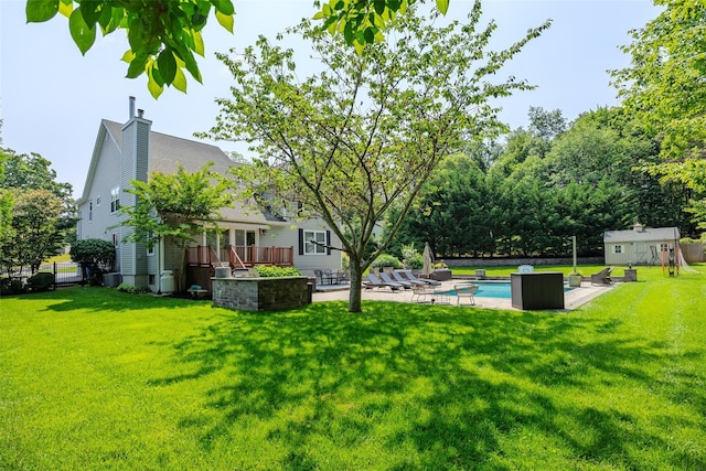7 Long View Dr, Wading River, NY 11792 - view of yard featuring a deck, an outdoor pool, a shed, and a patio area