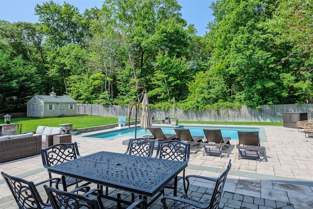 7 Long View Dr, Wading River, NY 11792 - fenced backyard with outdoor dining area, a patio, a storage unit, and outdoor lounge area