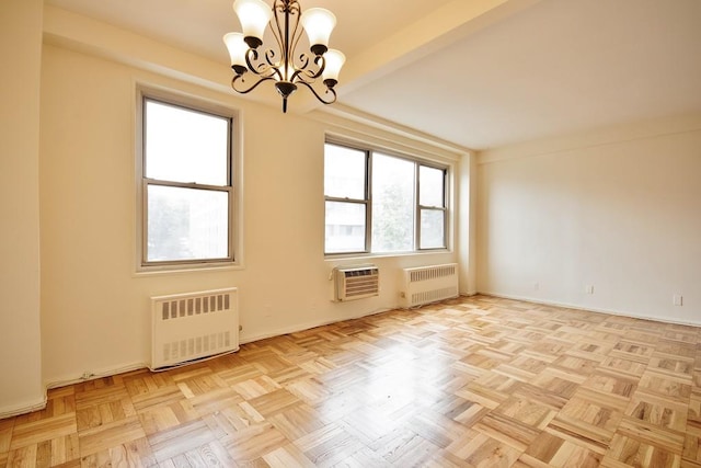 10 Lake St Unit 4E, White Plains, NY 10603 - empty room featuring radiator, a chandelier, and a wall mounted AC