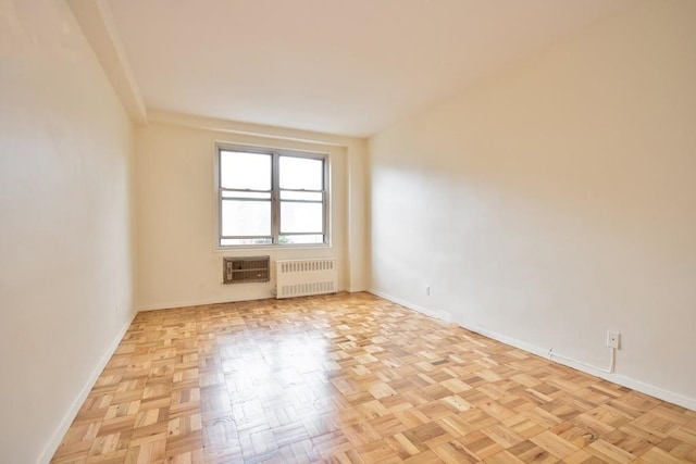 10 Lake St Unit 4E, White Plains, NY 10603 - unfurnished room with radiator heating unit and a wall unit AC