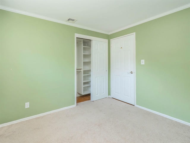 1 Barry Dr, Glen Cove, NY 11542 - unfurnished bedroom featuring carpet, crown molding, and a closet