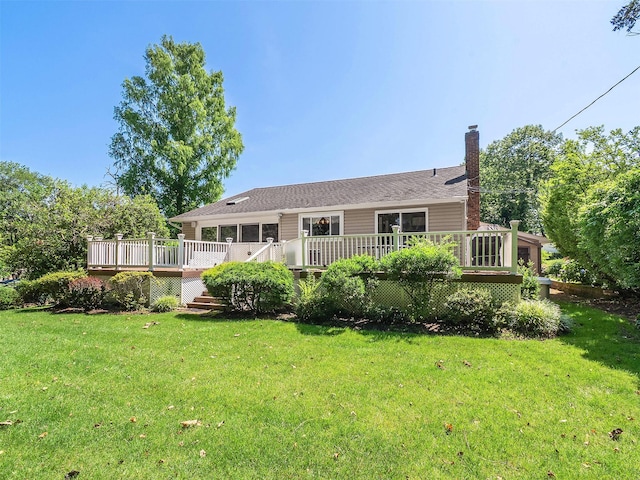 1 Barry Dr, Glen Cove, NY 11542 - back of house featuring a chimney, a deck, and a lawn