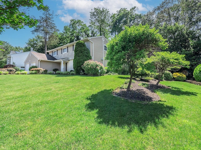 1 Barry Dr, Glen Cove, NY 11542 - view of grassy yard featuring a garage