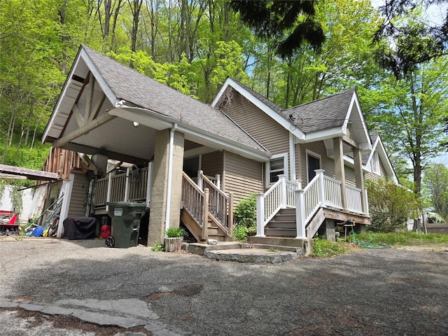 248 Pound Ridge Rd, Bedford, NY 10506 - view of front of house with a shingled roof and covered porch
