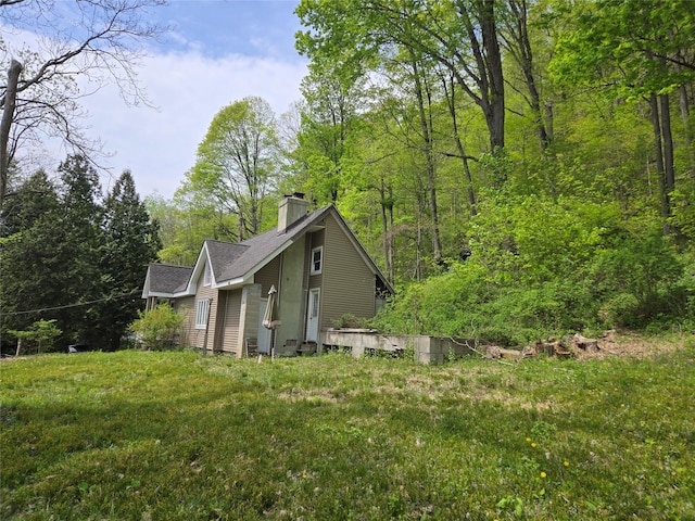 248 Pound Ridge Rd, Bedford, NY 10506 - view of side of home with a chimney and roof with shingles