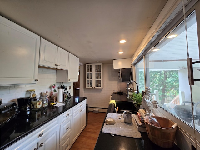 248 Pound Ridge Rd, Bedford, NY 10506 - kitchen with white cabinets, tasteful backsplash, glass insert cabinets, dark wood-style floors, and recessed lighting