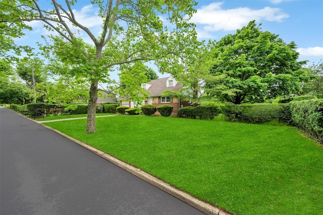 14 Byre Pl, Commack, NY 11725 - view of front of property with a front lawn and brick siding