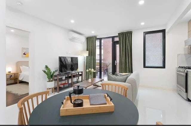 124-28 Queens Blvd Unit 10A, Kew Gardens, NY 11415 - living room with a wall mounted air conditioner, recessed lighting, and a wall of windows