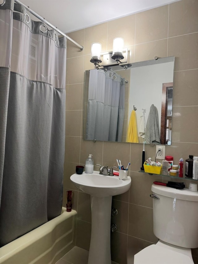 66-36 Yellowstone Blvd Unit 4F, Forest Hills, NY 11375 - full bathroom with tile walls, shower / tub combo, and backsplash