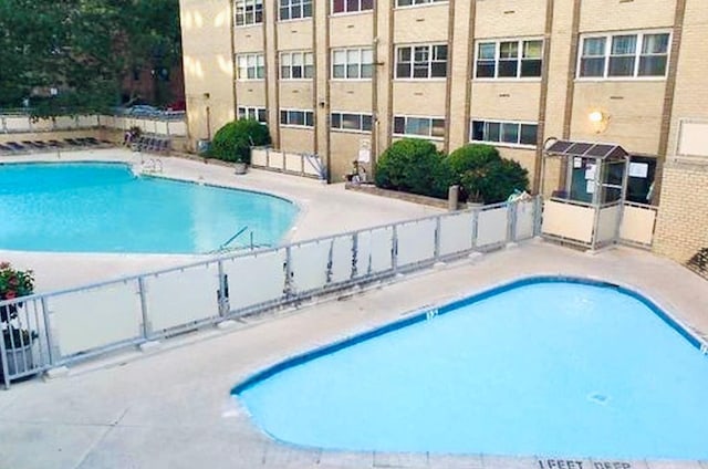 66-36 Yellowstone Blvd Unit 4F, Forest Hills, NY 11375 - community pool featuring a patio