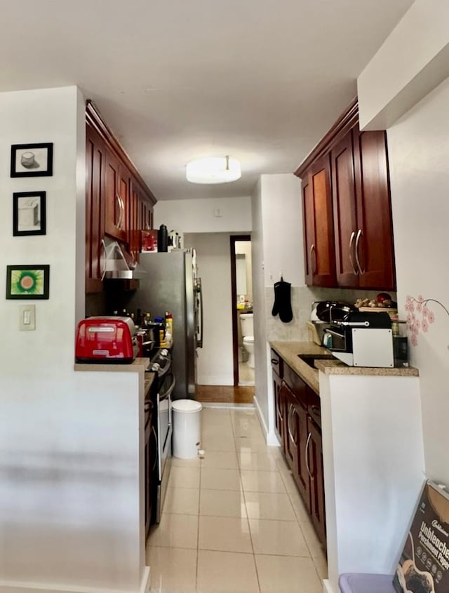 66-36 Yellowstone Blvd Unit 4F, Forest Hills, NY 11375 - kitchen featuring light tile patterned floors and baseboards