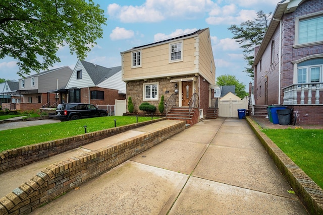 67-23 182nd St, Fresh Meadows, NY 11365 - view of front facade featuring a residential view and a gate