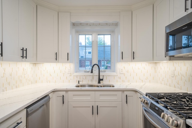 67-23 182nd St, Fresh Meadows, NY 11365 - kitchen featuring appliances with stainless steel finishes, white cabinetry, and decorative backsplash