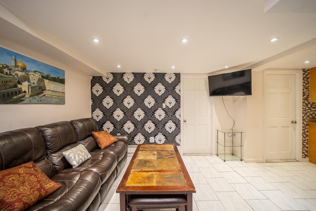 67-23 182nd St, Fresh Meadows, NY 11365 - living room with an accent wall, recessed lighting, and wallpapered walls