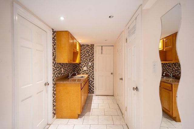 67-23 182nd St, Fresh Meadows, NY 11365 - kitchen with backsplash, recessed lighting, light tile patterned flooring, and brown cabinets