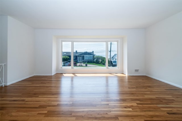 108 Kensington Oval, New Rochelle, NY 10805 - spare room featuring wood finished floors and baseboards