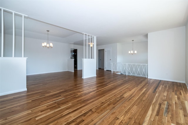 108 Kensington Oval, New Rochelle, NY 10805 - unfurnished living room featuring a chandelier and dark wood-type flooring