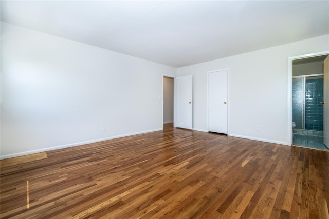 108 Kensington Oval, New Rochelle, NY 10805 - unfurnished bedroom with wood finished floors and connected bathroom
