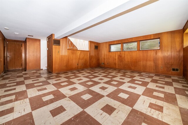 108 Kensington Oval, New Rochelle, NY 10805 - spare room featuring light floors and wood walls