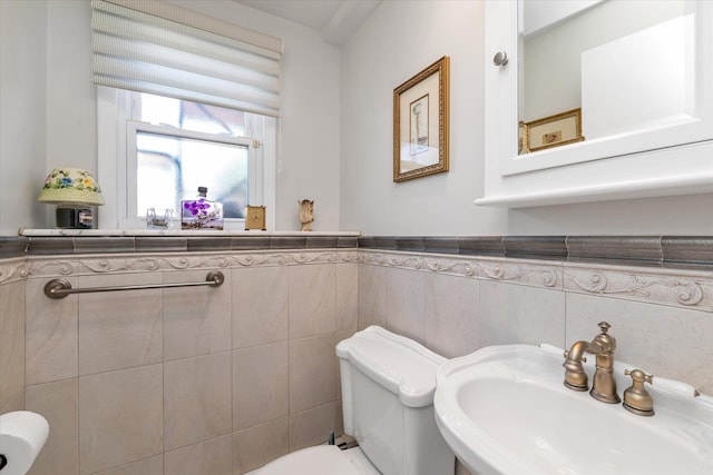 1182 Adrienne Ln, Seaford, NY 11783 - half bathroom with tile walls and wainscoting