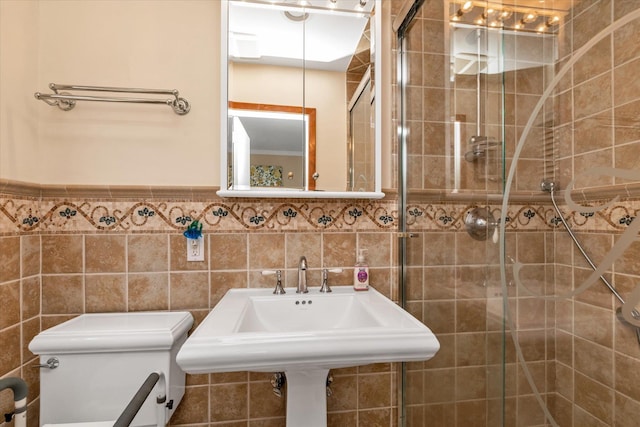 1182 Adrienne Ln, Seaford, NY 11783 - bathroom with a stall shower and tile walls