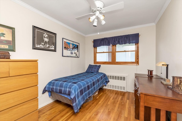 1182 Adrienne Ln, Seaford, NY 11783 - bedroom featuring radiator heating unit, light wood-type flooring, crown molding, and a ceiling fan