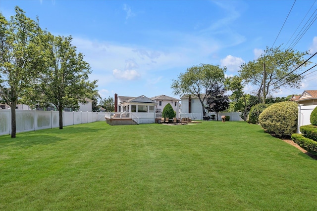 1182 Adrienne Ln, Seaford, NY 11783 - fenced backyard with a hot tub and a wooden deck