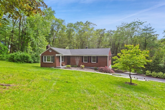 1 Hawthorne Ct, North Salem, NY 10560 - ranch-style home with a chimney, brick siding, and a front yard