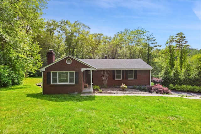 1 Hawthorne Ct, North Salem, NY 10560 - view of front of house with a chimney, a front yard, and brick siding