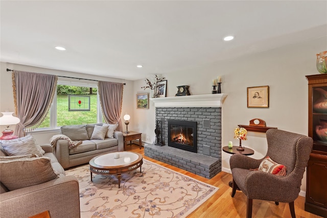 1 Hawthorne Ct, North Salem, NY 10560 - living room with a brick fireplace, wood finished floors, recessed lighting, and a baseboard heating unit