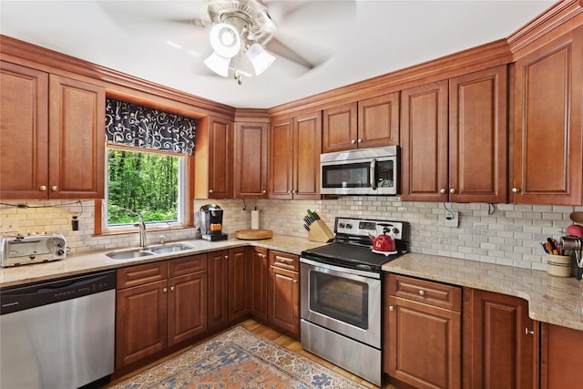 1 Hawthorne Ct, North Salem, NY 10560 - kitchen featuring stainless steel appliances, ceiling fan, decorative backsplash, light stone countertops, and light wood finished floors