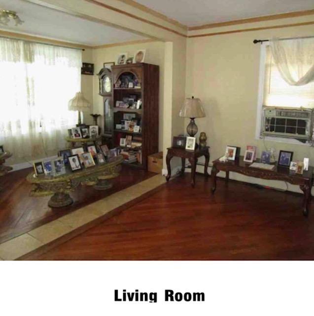 135-15 243rd St, Rosedale, NY 11422 - sitting room with wood finished floors and ornamental molding