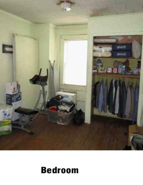 135-15 243rd St, Rosedale, NY 11422 - bedroom with crown molding and a closet
