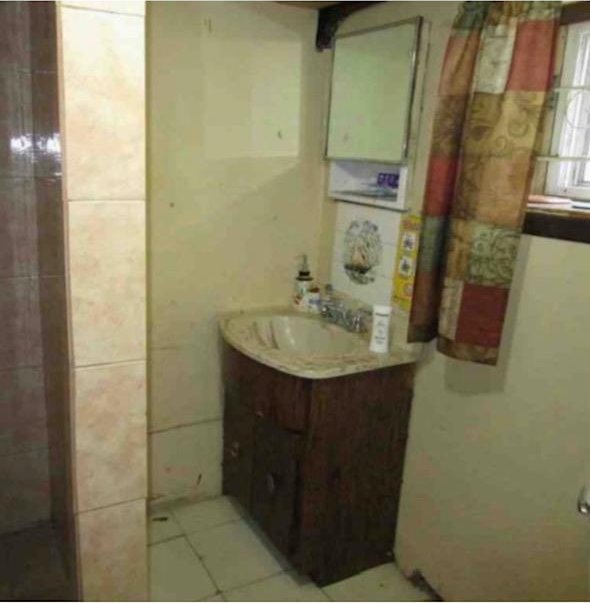 135-15 243rd St, Rosedale, NY 11422 - bathroom with vanity and tile walls